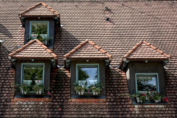A roof with four dormer windows