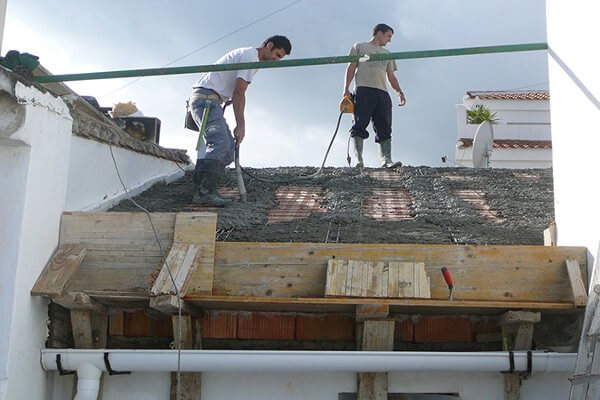 contractors installing a new asphalt shingle roof